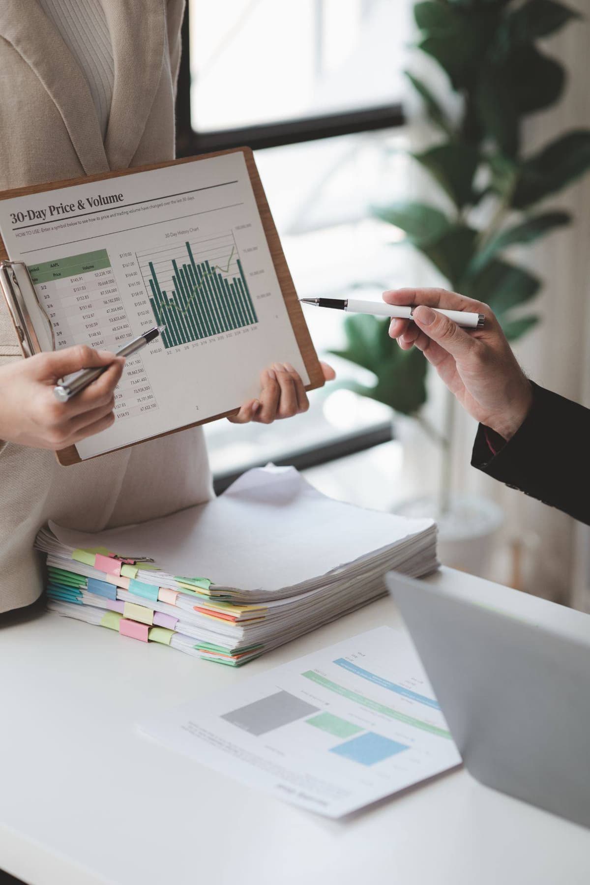 Reviewing performance data together during a client meeting