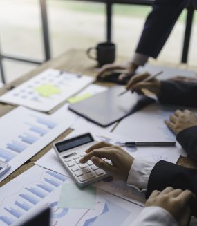 Meeting business team brainstorming number and graph, chart, company financial growth study and analyze marketing strategy planning.